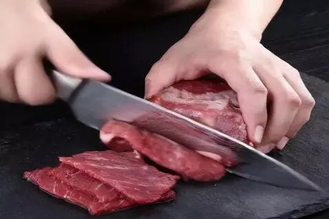 AI Video from prompt: A man cuts meat
