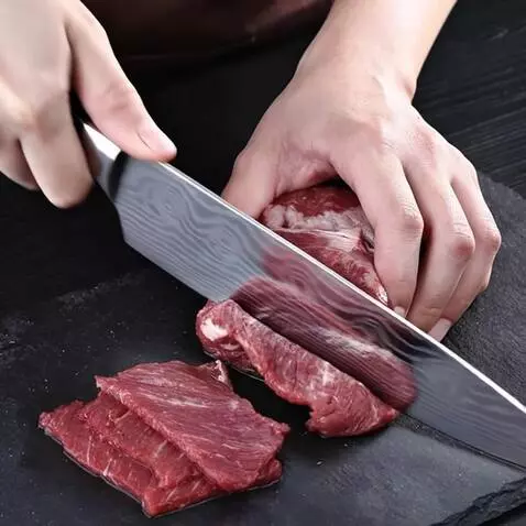 AI Video from prompt: a man cuts meat with a blunt knife