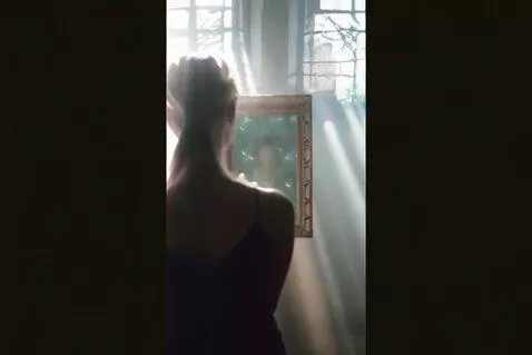 AI Video from prompt: A cinematic, vertical 9:16 scene of a woman stan