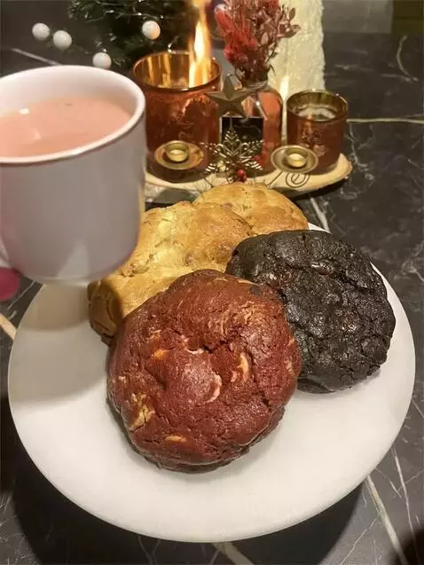 AI Video from prompt: Friends enjoying these cookies with a hot cup of