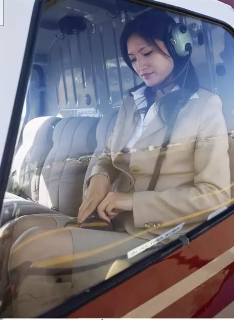 AI Video from prompt: woman in business suit, sitting in a helicopter,