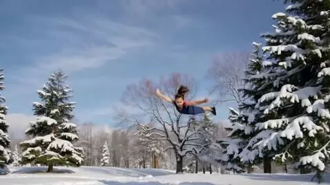AI Video from prompt: a girl child  flying in the snow