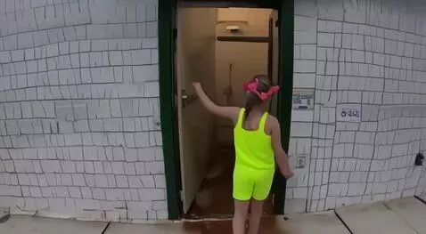 AI Video from prompt: 10 year old girl going to the bathroom of a indo