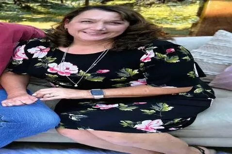 AI Video from prompt: the woman stands up and turns around showing of 