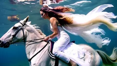 AI Video from prompt: A beautiful lady dressed as a bride riding her h