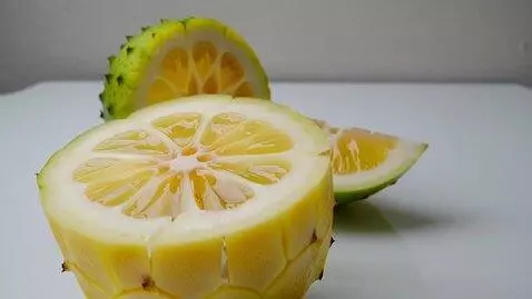 AI Video from prompt: A perrectly smooth Yellow glass pineapple is sli