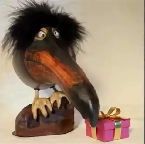 AI Video from prompt: A gift appears next to it, it opens it and then 