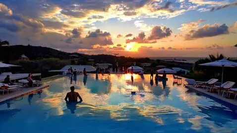AI Video from prompt: Infinity pool with people partying