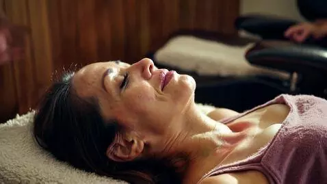 AI Video from prompt: show a middle aged woman getting a luxurious mas
