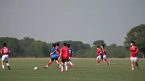 AI Video from prompt: A football match between two kiddie teams with j