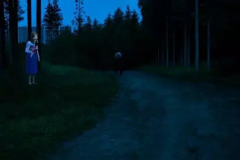 AI Video from prompt: Scene: Early evening near the edge of a dark, de