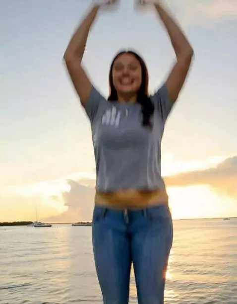 AI Video from prompt: A joyful woman with a thick, fit body dance with
