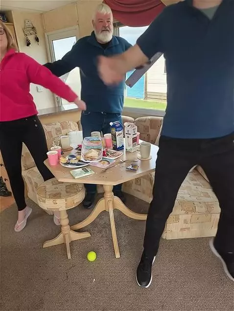 AI Video from prompt: The all get up and start  dancing, doing the mac