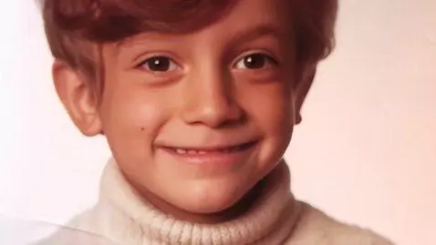AI Video from prompt: he smiles and gigles