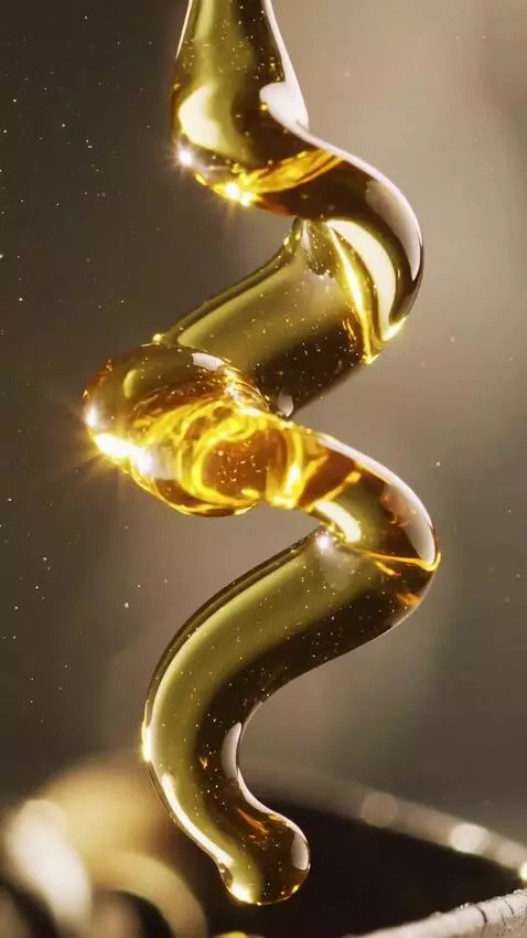 AI Video from prompt: Extreme close-up macro shot of pure olive oil an