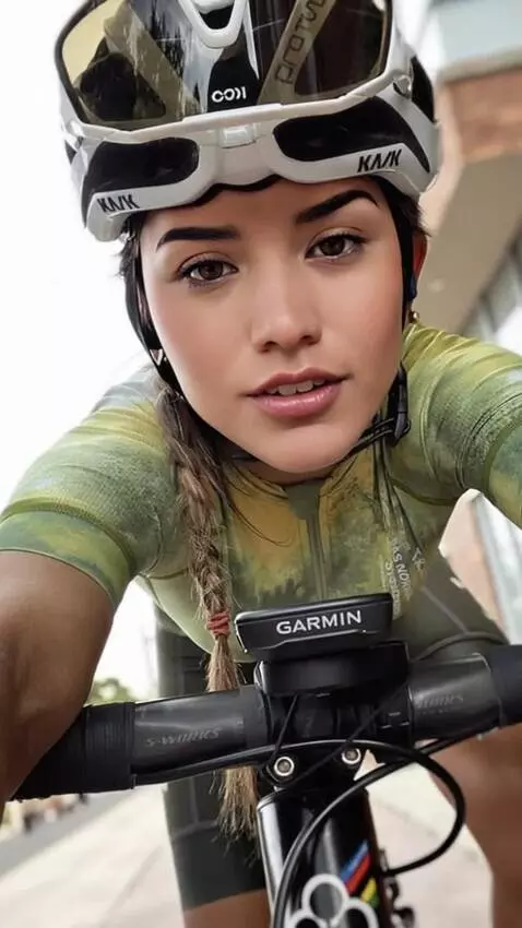 AI Video from prompt: A girl is riding a bicycle, moving her body as s