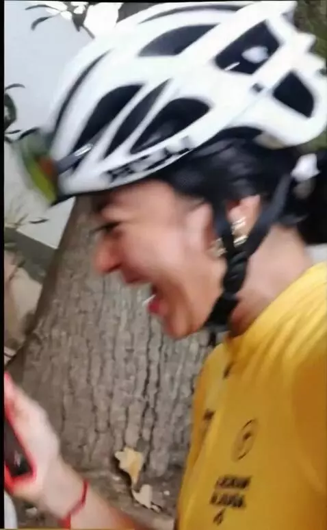 AI Video from prompt: A girl rides a bicycle, shudders from the ride, 