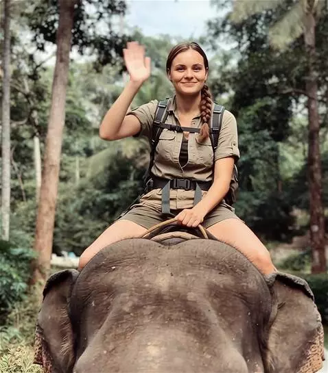 AI Video from prompt: a girl is riding an elephant towards [someone]. 