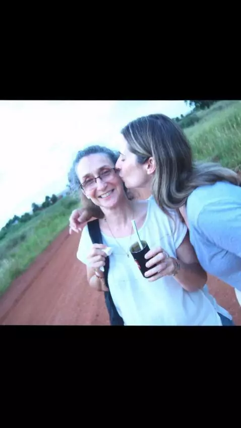 AI Video from prompt: The woman is kissed by a swinger wife