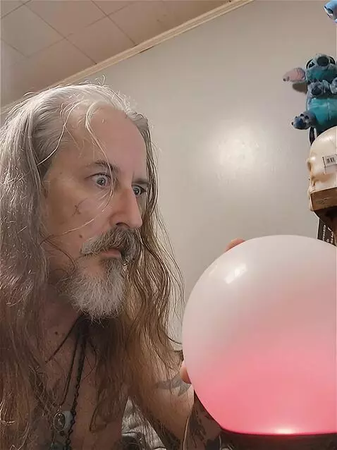 AI Video from prompt: Make the crystal ball light up red. then explode