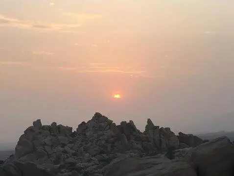 AI Video from prompt: The camera soars forward over the rocks providin