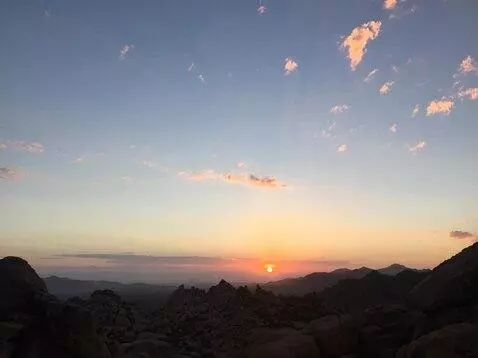 AI Video from prompt: the camera soars upwards and forward revealing a