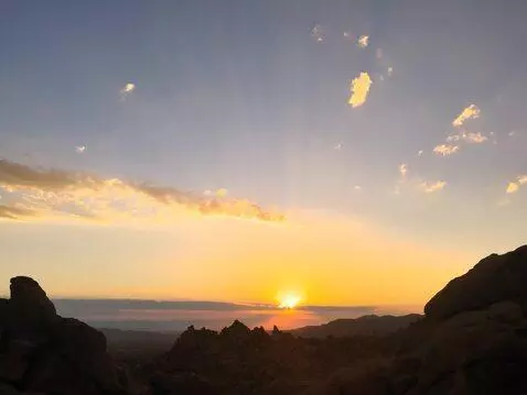 AI Video from prompt: the camera soars upwards and forward revealing a