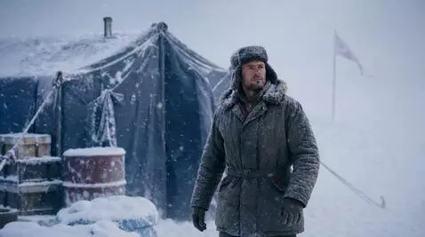 AI Video from prompt: A polar explorer in a warm overalls and a shakap