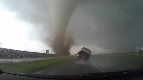 AI Video from prompt: A tornado lifts car. that recorded dashcam