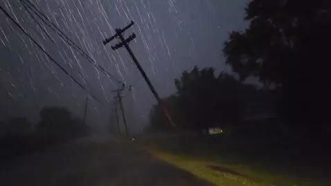 AI Video from prompt: Derecho windstorm causes powerflashes on powerli