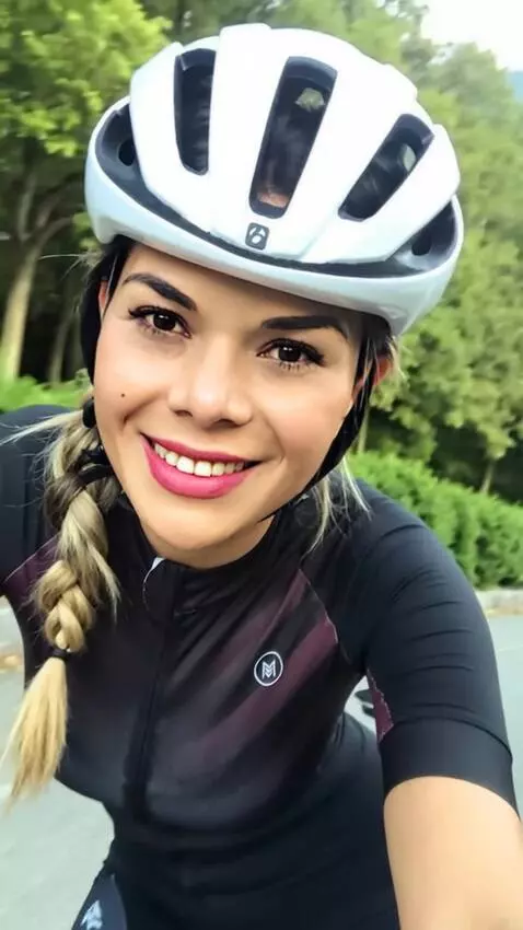 AI Video from prompt: A woman in a short skirt is riding a bicycle and