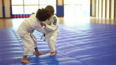 AI Video from prompt: two boys at six years,wearing bjj jackets,white 