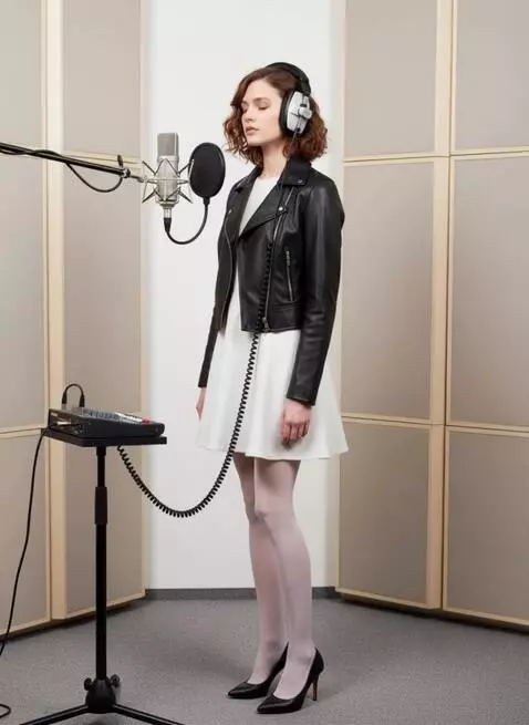 AI Video from prompt: The woman feels a sudden itch on her leg, she sl
