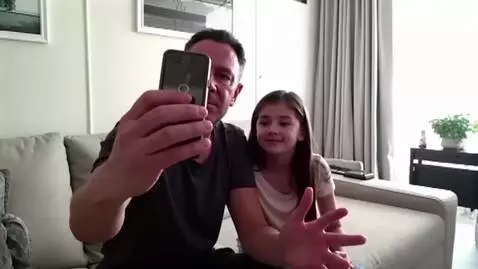 AI Video from prompt: A 40-year-old Russian man is sitting on the sofa