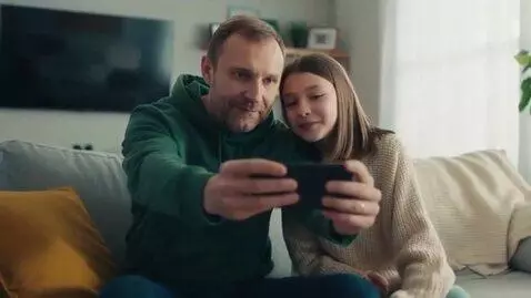 AI Video from prompt: A 40-year-old Russian man is sitting on the couc