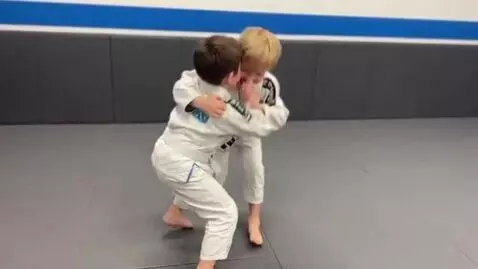 AI Video from prompt: two boys at six years,wearing bjj jackets,white 