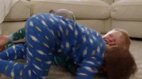 AI Video from prompt: two toddler boys,pajamas,angry fight,clinch and 