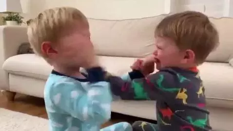 AI Video from prompt: two toddler boys,pajamas,angry fight,pinching ea