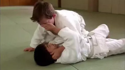 AI Video from prompt: Two boys at six years,angry fight,wearing judo j