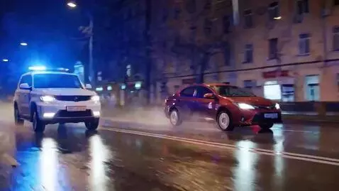 AI Video from prompt: It's night, wet asphalt after rain, a city stree
