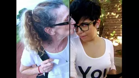 AI Video from prompt: The woman with long hair kisses the short haired