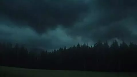 AI Video from prompt: occasional lightning flashes illuminating the da
