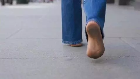 AI Video from prompt: smiling young woman barefoot with slightly dirty
