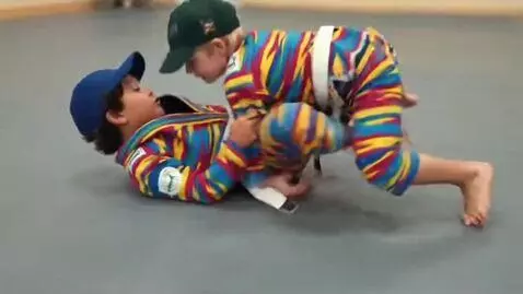 AI Video from prompt: Two boys at six years,wearing basecaps,multicolo