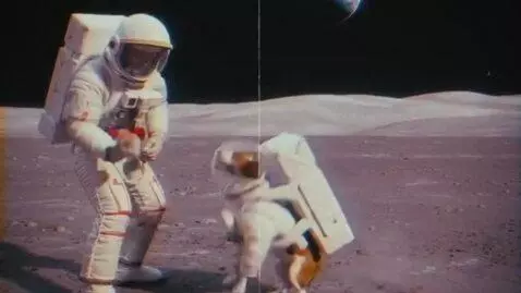 AI Video from prompt: a man playing wit his dog in the space old foota