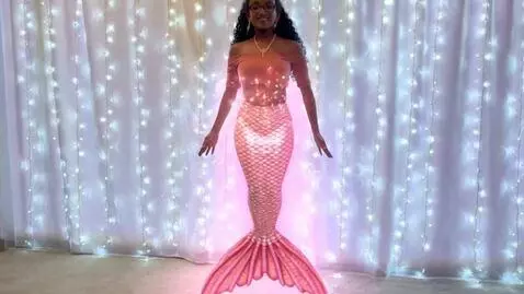 AI Video from prompt: Pink voluptous mermaid transformation