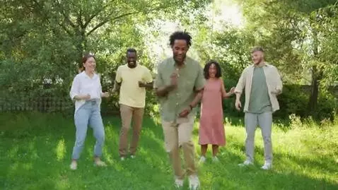 AI Video from prompt: a man dance with his friends in gard