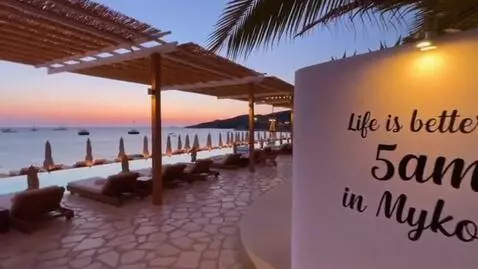 AI Video from prompt: Create a video of a beach club in Mykonos with a