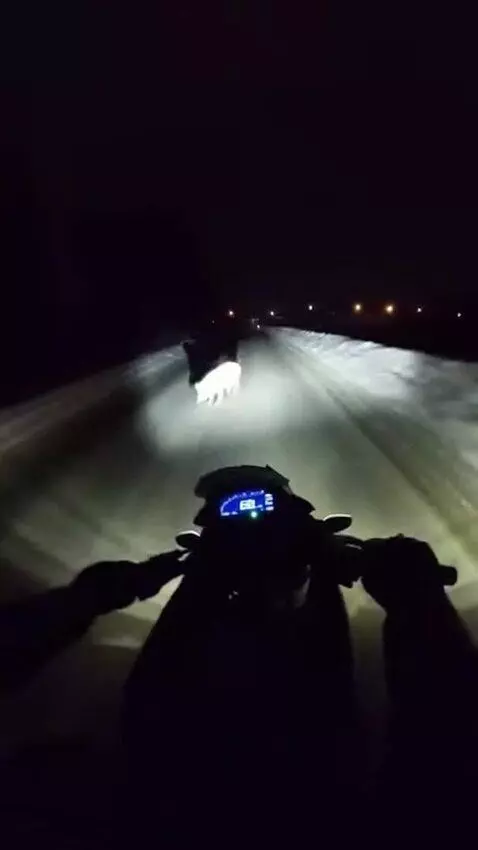 AI Video from prompt: First-person perspective. I'm riding a motorcycl