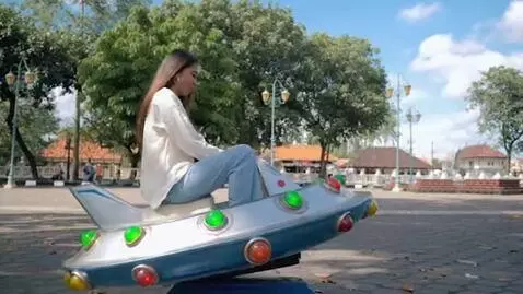 AI Video from prompt: a Gen Z woman with a straight long hair sitting 